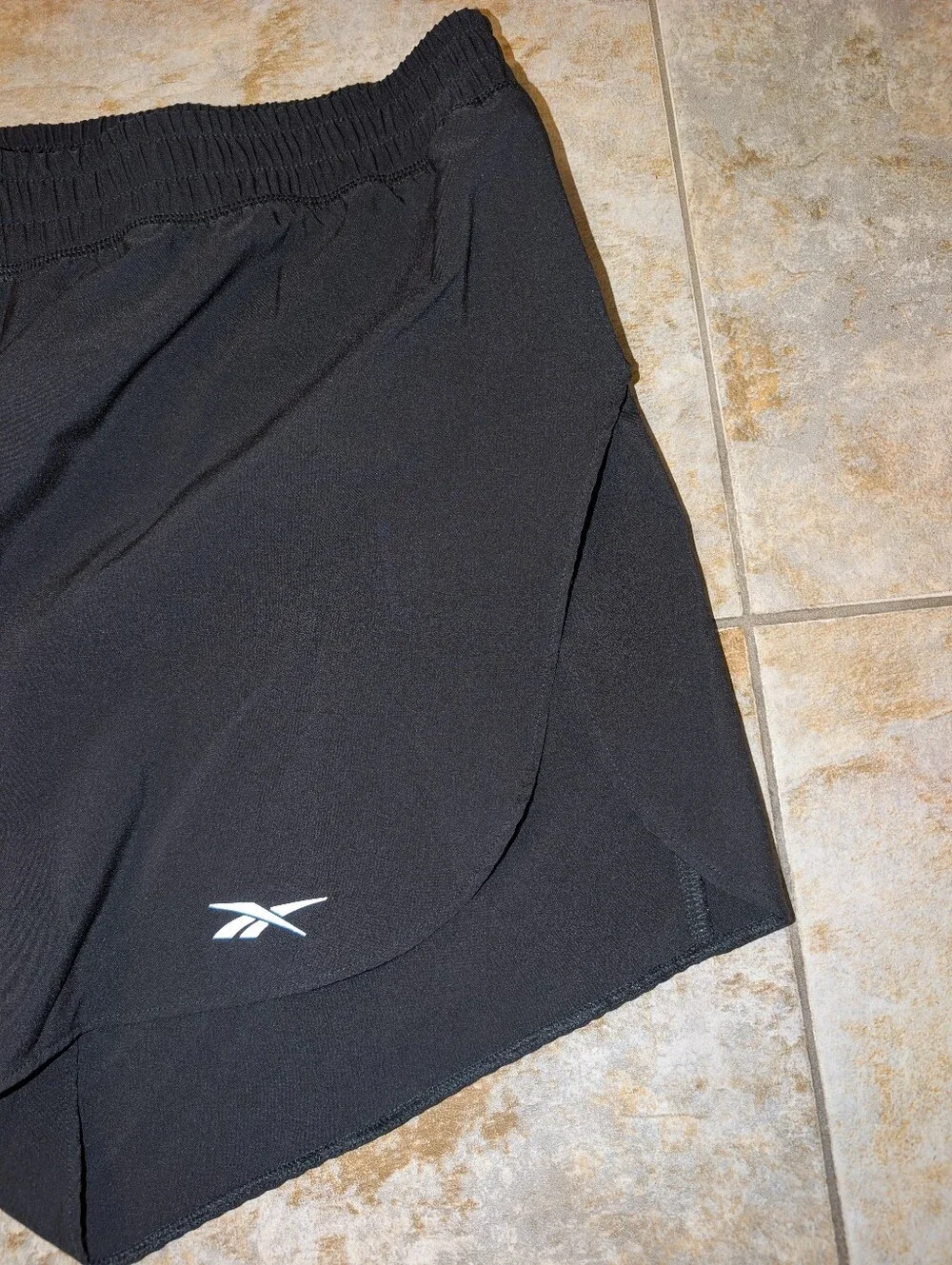 Reebok Black Workout Shorts with White Logo Accent